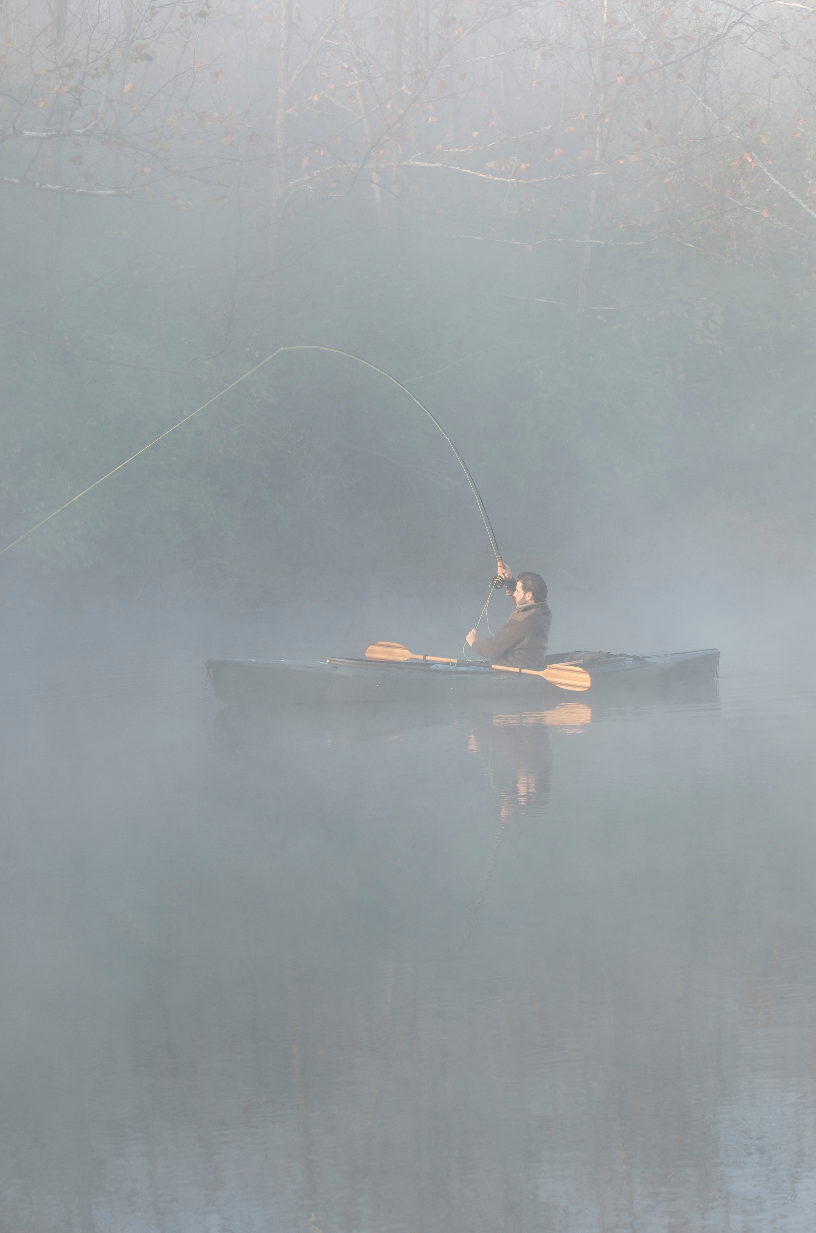 A kayak angler ties into a big fish on a Pyramid State Recreation Area strip pit.