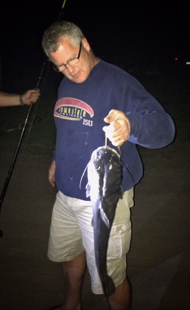Bob Lambertz holds up the catfish that won family reunion bragging rights.  